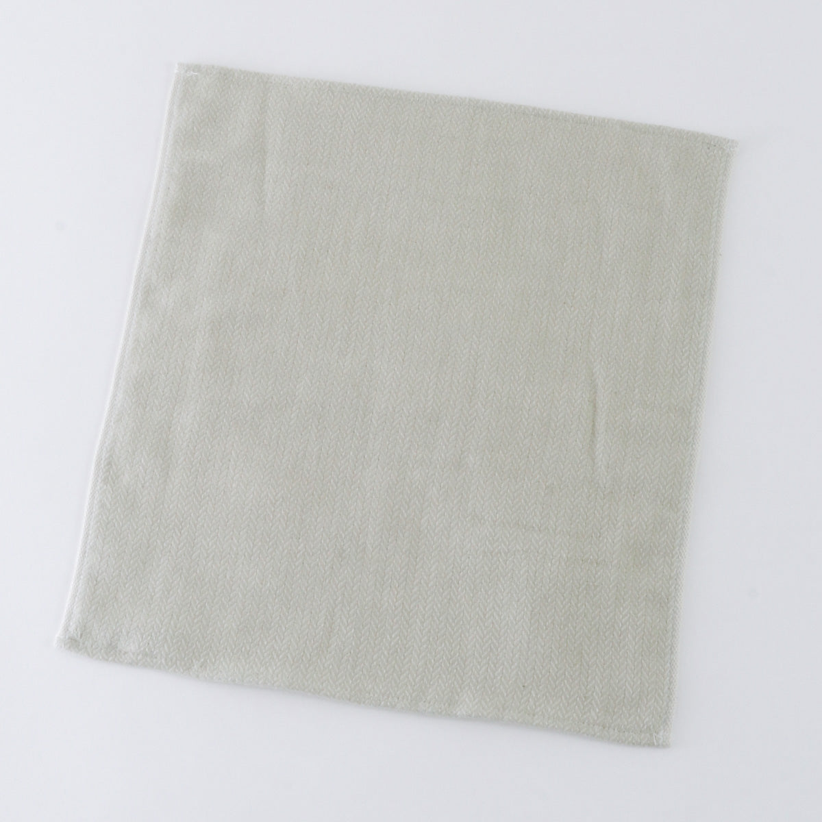 Tea-dyed organic gauze guest towel in Green