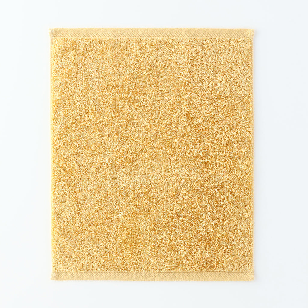 Plant-dyed Organic Pile guest towel in Yellow
