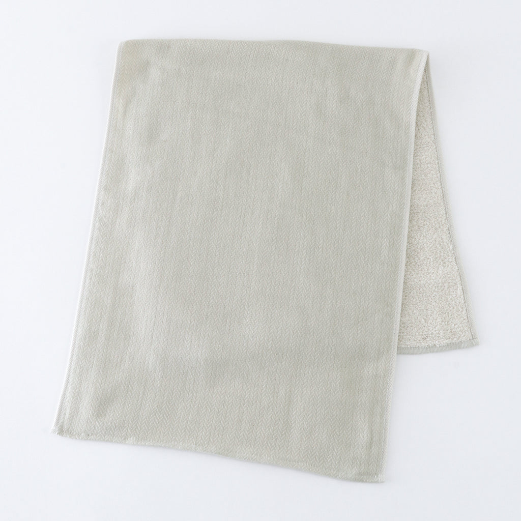 Tea-dyed organic gauze face towel in Green