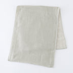 Tea-dyed organic gauze face towel in Green