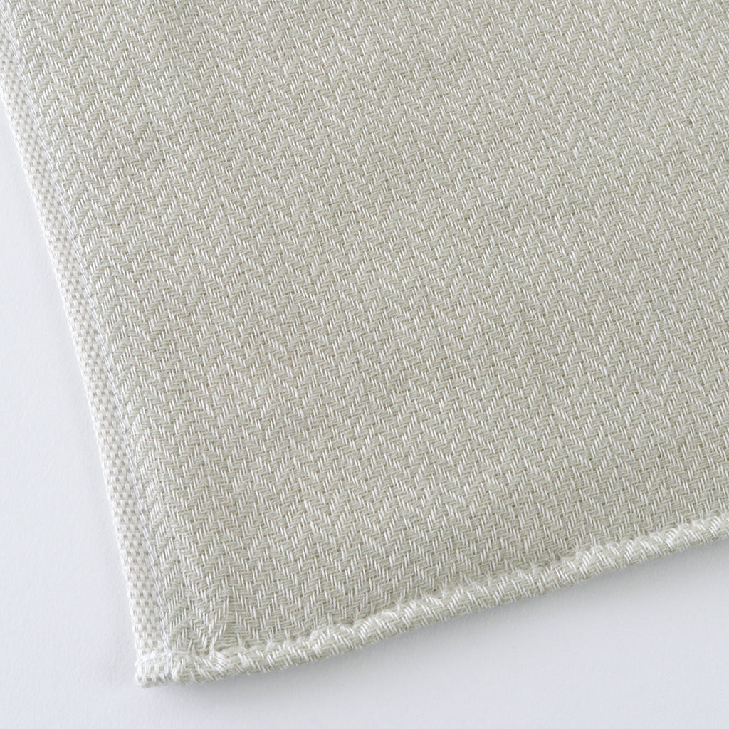 Tea-dyed organic gauze face towel in Green