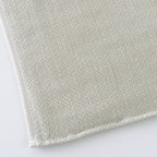 Tea-dyed organic gauze face towel in Green