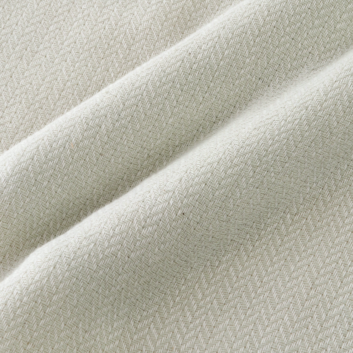 Tea-dyed organic gauze face towel in Green