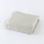 Tea-dyed organic gauze face towel in Green