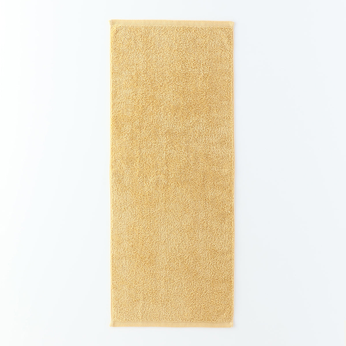 Plant-dyed Organic Pile face towel in Yellow