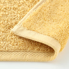 Plant-dyed Organic Pile face towel in Yellow
