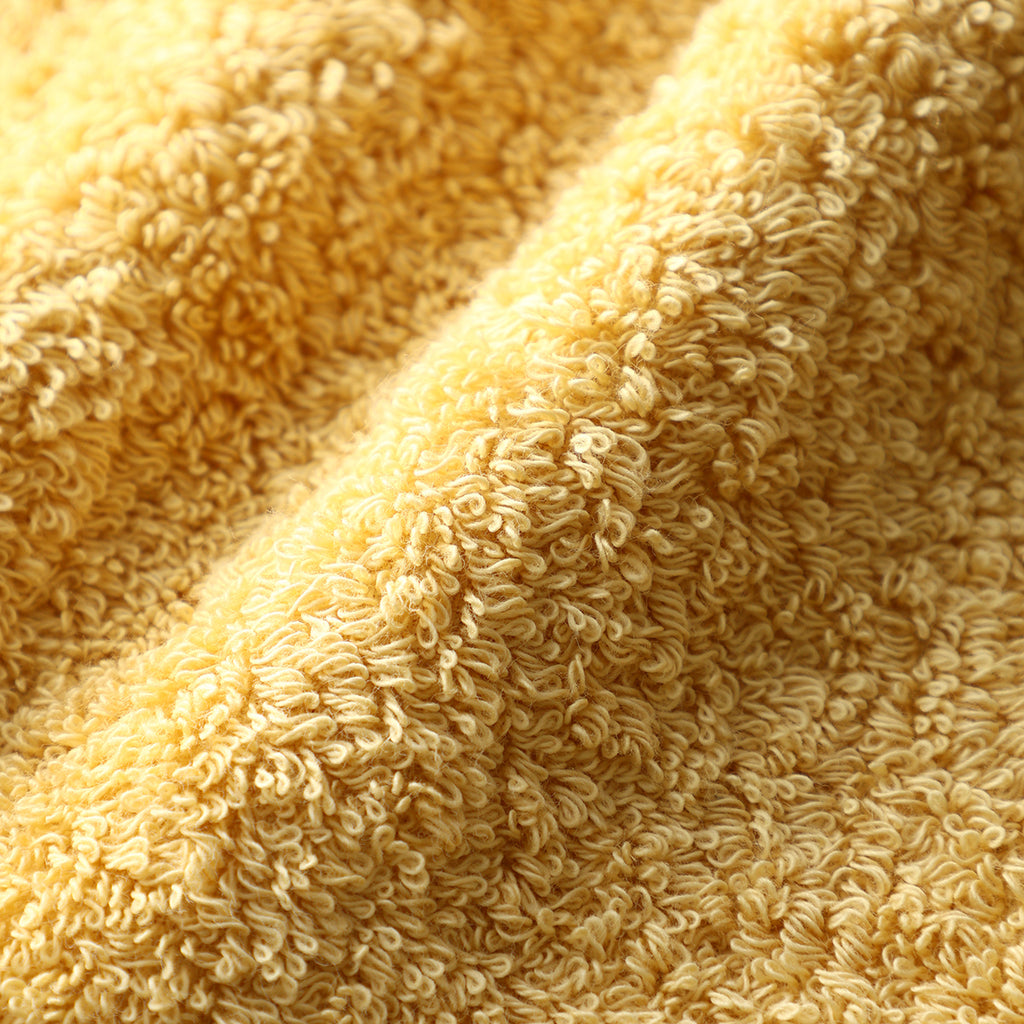 Plant-dyed Organic Pile face towel in Yellow