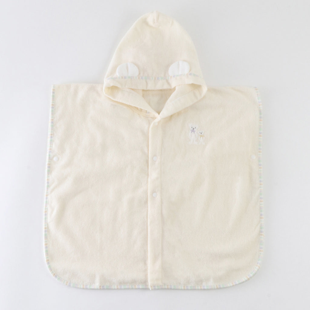 Airy Touch baby poncho in Ivory