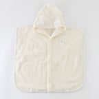 Airy Touch baby poncho in Ivory