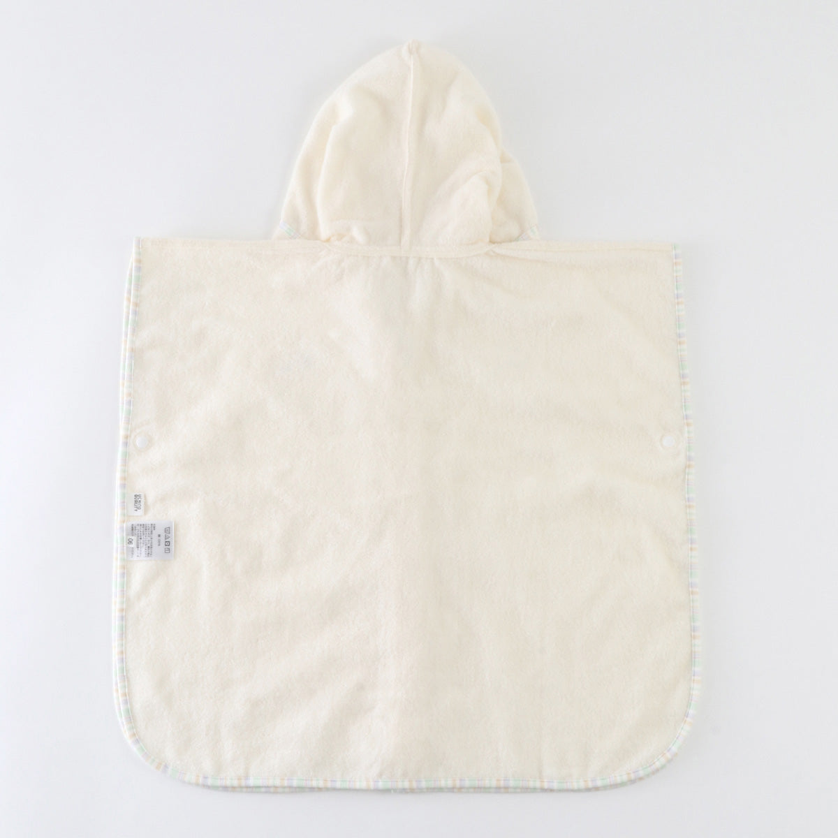 Airy Touch baby poncho in Ivory