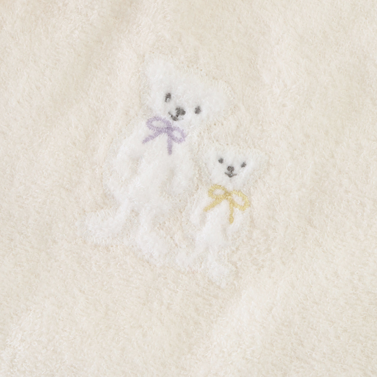 Airy Touch baby poncho in Ivory