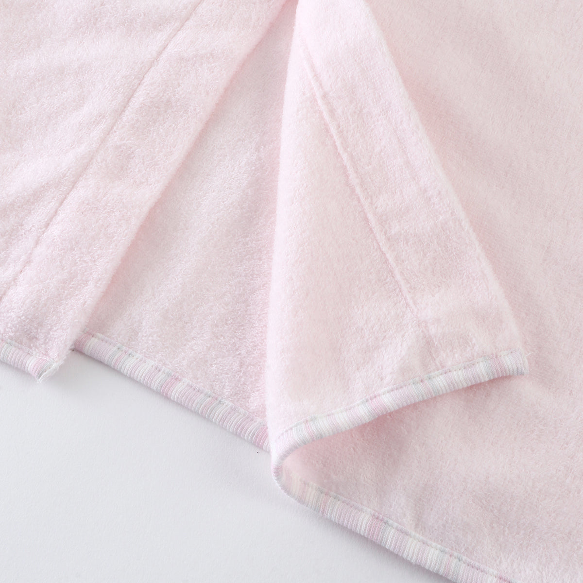 Airy Touch baby poncho in Pink